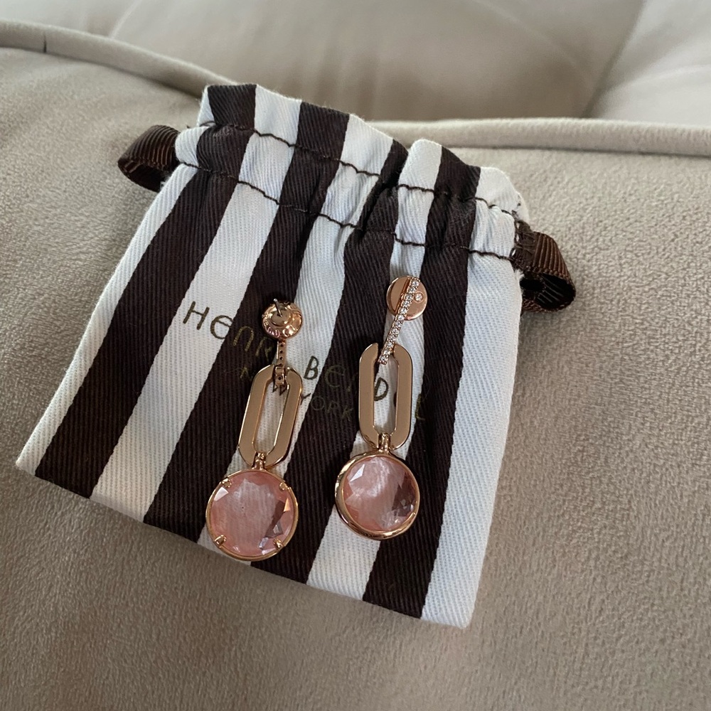 Henri bendel paper clip ratings with a light pink gem
